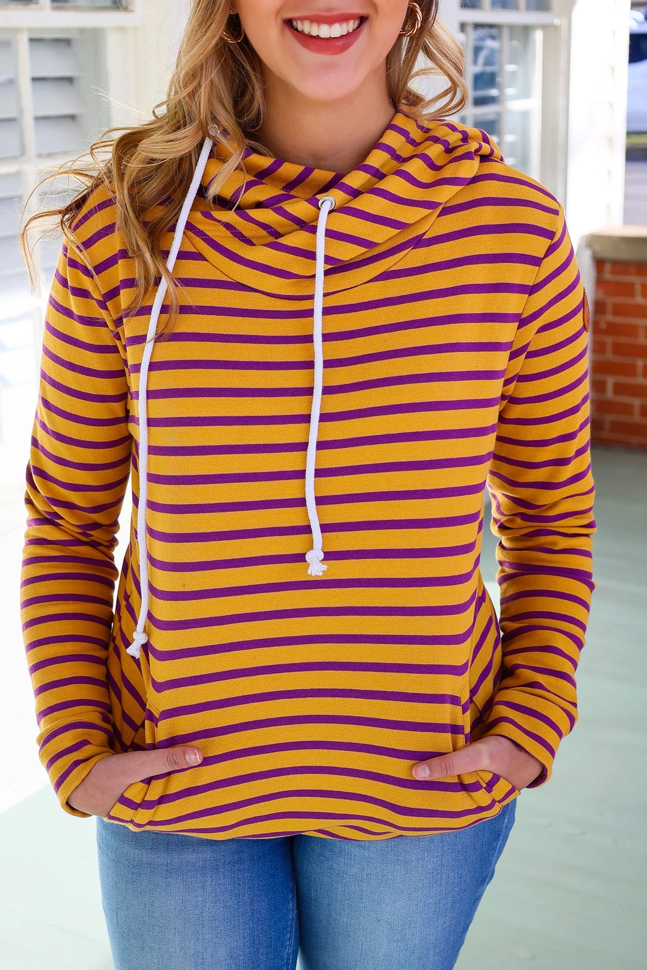 Yellow hoodie with black top stripe